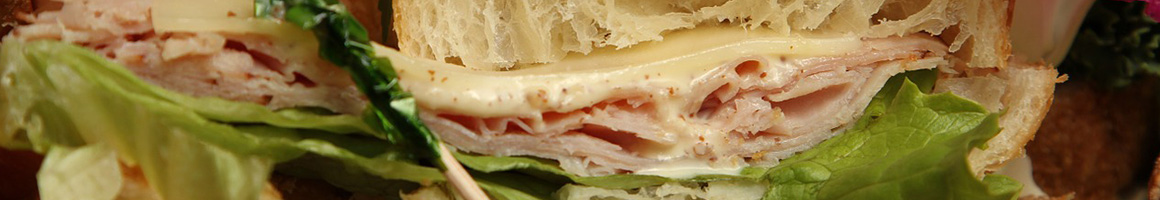 Eating Deli Sandwich at Pickles Deli restaurant in Newbury Park, CA.
